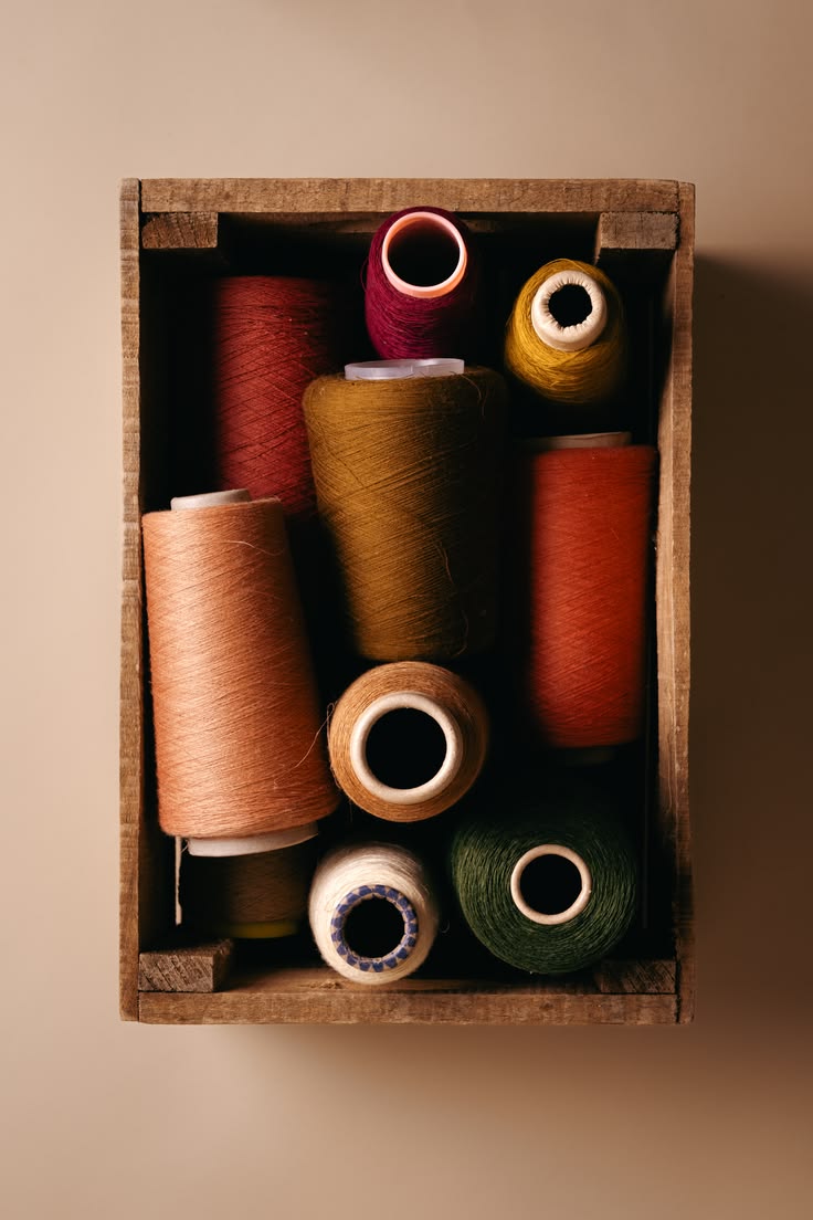 Crate of waxed linen thread spools